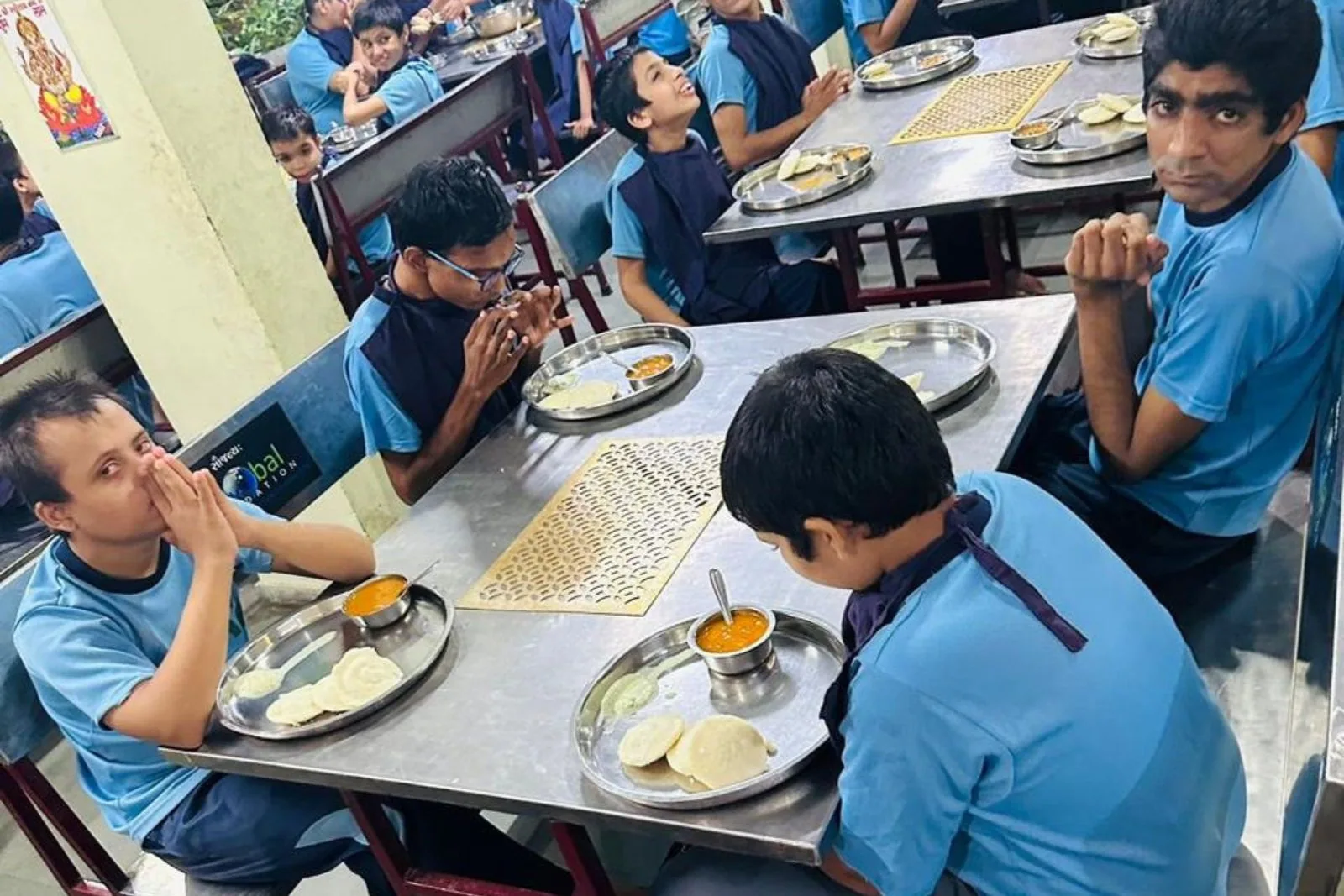 A Shree Foundation volunteer serving a meal during a support drive